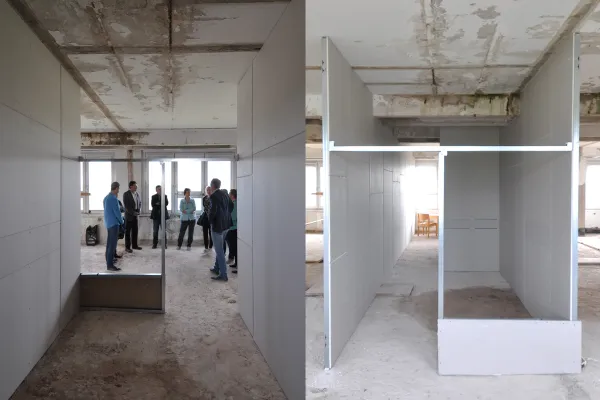 Mehrere Menschen bei einer Baustellenbesprechung